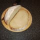 Thick slice of bread from circular loaf for toasting