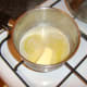 Butter is slowly melted for adding to chicken