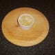 Melted butter is poured in to ramekin with chicken