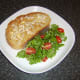 Chicken butter toast is plated with salad