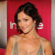 Minka Kelly wearing diamond hoop earrings