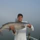 Jamie with a good blue catfish caught on a foggy afternoon on Lake Marion.
