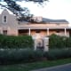 You can tell because of the typical Dutch Colonial style architecture presented on part of the roof.