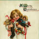 Free vintage Christmas cards: Little child in pajamas carrying antique toys