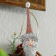 The whole of Santa's costume sparkles with iridescent glitter.