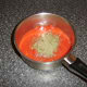 Preparing the tomato sauce for the fish pie