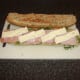 Camembert is placed on top of the bacon