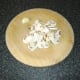 Mushrooms are sliced and garlic clove is peeled