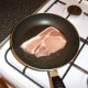 Pork chop is gently fried in oil