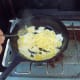 Beat eggs and scramble. You only need 1 or 2 eggs at most per person.