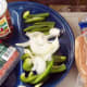 Chili Hot Dogs are yummy with organic hot dog weenies, organic chili beans, and fresh-cut green pepper and onions.