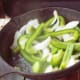 Sautee the onions and peppers at the same time as you are cooking the hot dogs. Then heat the chili beans in a separate pan.