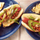 Yummy chili hot dogs with a side of salt and vinegar kettle chips.