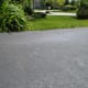 Use a pressure washer to clean driveways before sealing