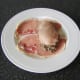 Chicken fillet is laid on haggis