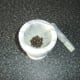 Black peppercorns ready to be crushed in pestle and mortar