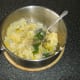 Chives and seasoning are stirred through clapshot