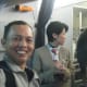 A camera-shy (?) attendant with TM before boarding the plane