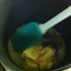 Melting the butter with the sugar, syrup, and then add the milk with baking soda mixture