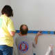 Marking the walls for the two-toned paint.