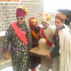 The mother and the father of the son performing the ceremonies.