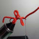 Forming the second worm's loop.