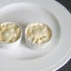 Mincemeat puff pastry pies are crimped and glazed