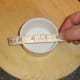 Measuring ramekins before cutting puff pastry casings