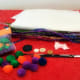 Use supplies you may already have around the house that you might normally throw away, like tissue paper and old buttons.