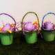 Paint yogurt cups and use pipe cleaners as handles. Stuff with recycled newspaper or scraps of paper. You can put Easter eggs and candy inside.