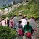 The villagers going to receive the flower gatherers