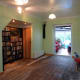 Side view showing alcove under the stairs and door to the cloakroom