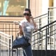 Kim Kardashian in tight jeans and high heels