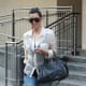 Kim Kardashian in tight jeans and high heels