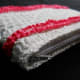 A simple pouch making use of the crab stitch (reverse single crochet) as emphasis