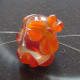 Close-up of bead threaded for crimpless attachment.