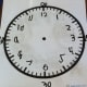 When my son had mastered telling time to the quarter hour, I found this worksheet helped reinforce the skill. The worksheet, available from Math-Aids.com (link above), is a blank clock. I put it in a plastic sleeve, so he could practice writing the h