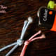 Figure 5. Secure the loose end of the elastic by melting it near fire. DO NOT put in fire, the elastic will be charred! Just put it close to the fire for the loose ends to melt in place.