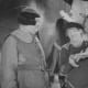 Stan Laurel demonstrates something he believes Oliver Hardy can't do.