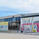 View of that side of the building with the three distinct murals