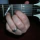 This is the D chord as a photo - might be helpful to understand the basics. The diagrams are upside down to the guitar because that is how TAB is written, but the photo is the right way. Guitar players soon get used to it so don't worry. That is why