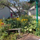 Benches nestle among beautiful bushes and flowers for you to rest and enjoy.