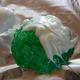 Melt white chocolate candy wafers. Use a paintbrush to apply the chocolate to the rock candy (crystallized sugar).