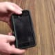 Slide your finger in the groove between the rubber outer shell and the hard plastic case inside of it. Work your finger around your iPhone to separate the out rubber shell, and then remove the rubber shell.