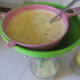 Passing star fruit juice through a sieve