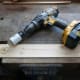Hole saw cutter attached to the electric drill.