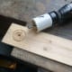 For a neat finish, cut part way through, and then turn the wood over to finishing cutting the hole from the other side.