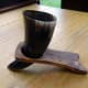 Viking drinking horn in its stand and ready for use.