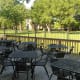 The outdoor eating area of the restaurant overlooking the park