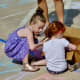 Children doing some chalk art at Creekfest